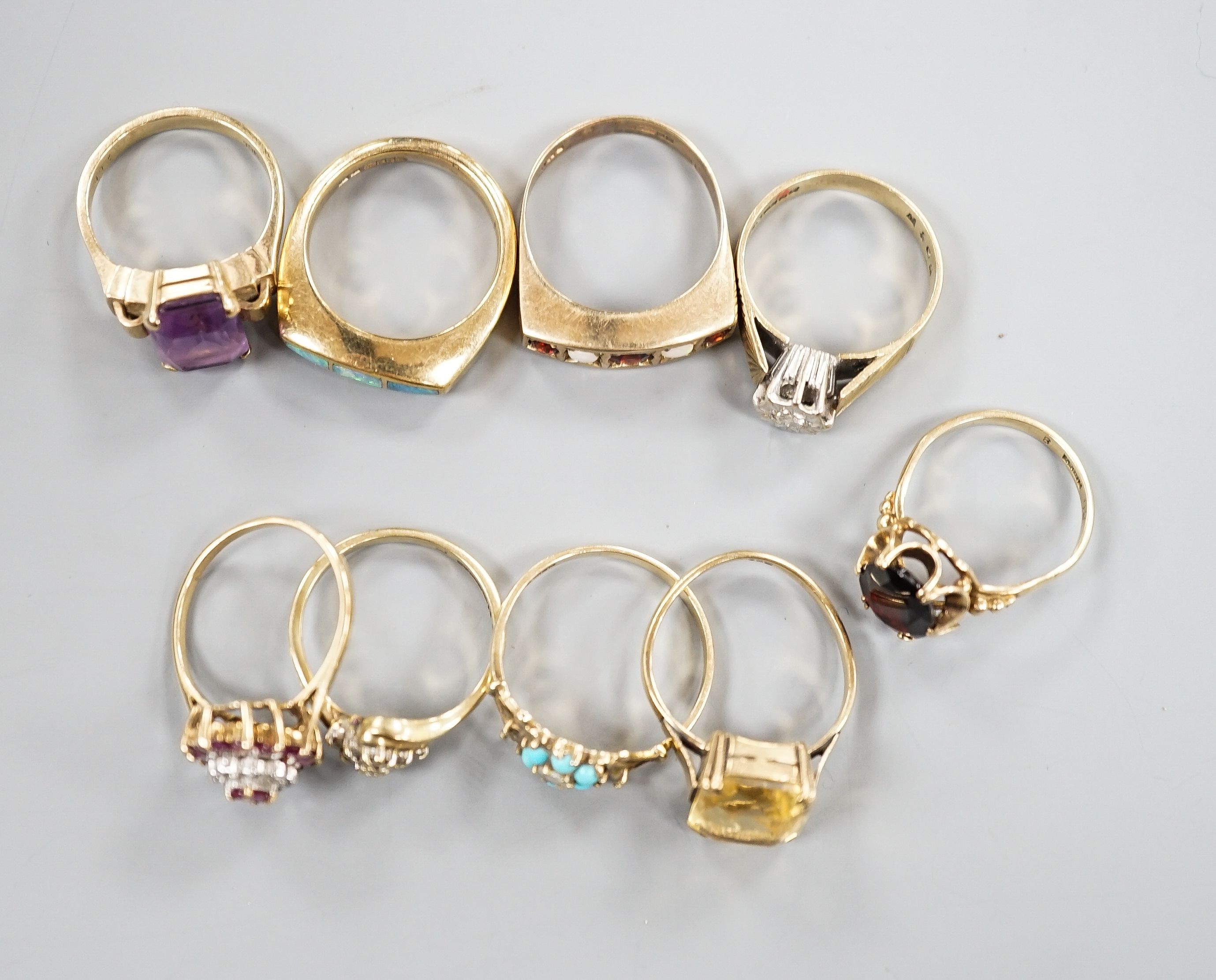 Nine assorted mainly modern 9ct and gem set dress rings, gross weight 29.9 grams.